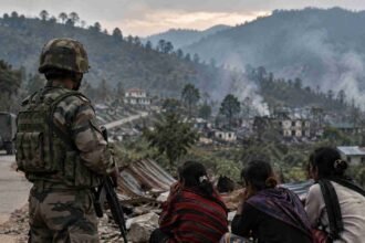 Checkpoint Overlooking a Smoke Filled Village compressed 1