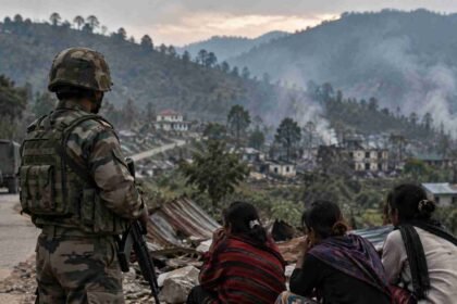 Checkpoint Overlooking a Smoke Filled Village compressed 1